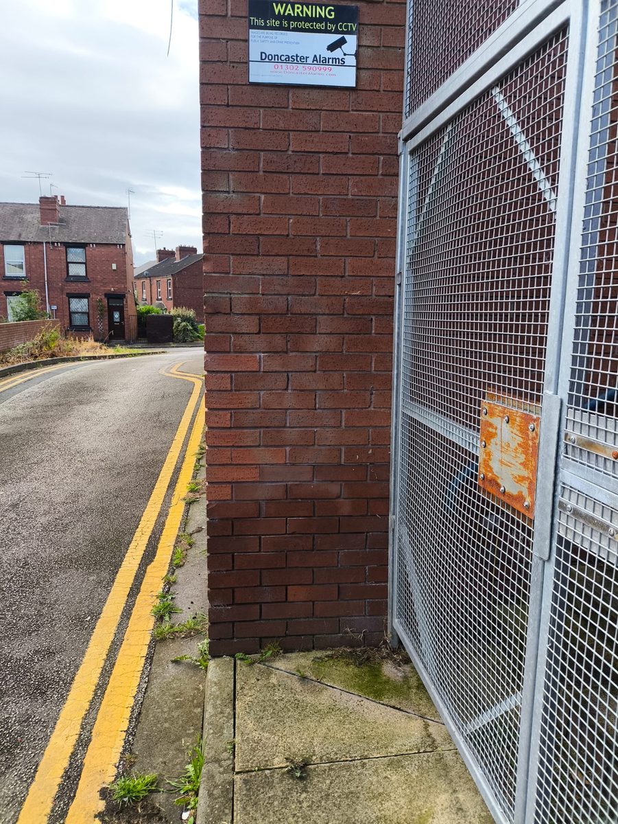 Brick pillar restored after graffiti removal